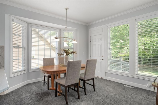 14393 S Cody St, Olathe, KS 66062 - dining space with dark colored carpet, crown molding, baseboards, and a chandelier