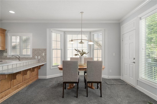 14393 S Cody St, Olathe, KS 66062 - dining room featuring dark carpet, baseboards, and crown molding