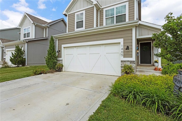 1405 Newport Ln, Raymore, MO 64083 - view of front of property with a garage, board and batten siding, concrete driveway, and stone siding