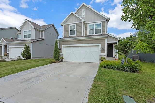 1405 Newport Ln, Raymore, MO 64083 - craftsman house featuring board and batten siding, an attached garage, concrete driveway, and a front lawn