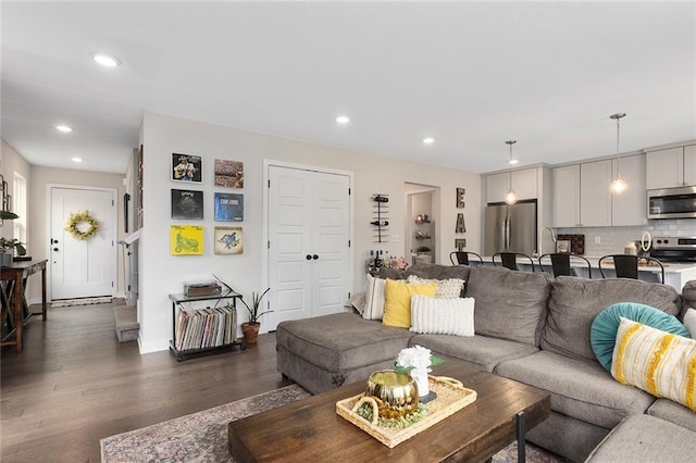 1405 Newport Ln, Raymore, MO 64083 - living room with dark wood-style flooring and recessed lighting