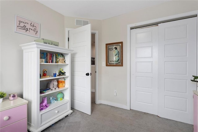 1405 Newport Ln, Raymore, MO 64083 - bedroom featuring carpet flooring and a closet