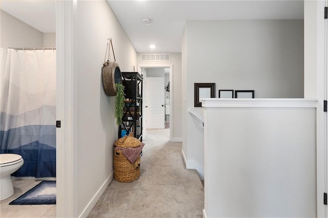 1405 Newport Ln, Raymore, MO 64083 - hall featuring recessed lighting, light colored carpet, and baseboards