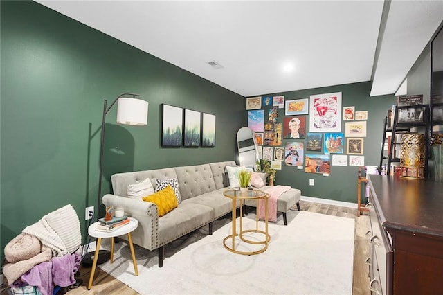 1405 Newport Ln, Raymore, MO 64083 - living area with wood finished floors and baseboards
