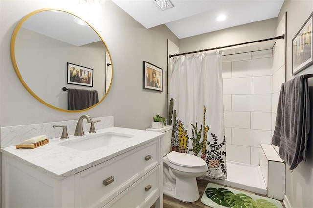 1405 Newport Ln, Raymore, MO 64083 - full bath with toilet, wood finished floors, a stall shower, vanity, and recessed lighting