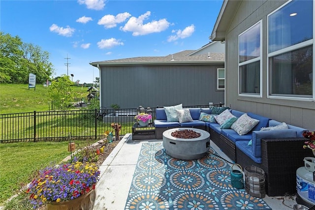 1405 Newport Ln, Raymore, MO 64083 - view of patio / terrace with an outdoor living space with a fire pit
