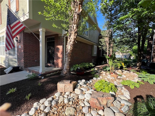 16049 S Brookfield St, Olathe, KS 66062 - view of property exterior featuring brick siding and stucco siding