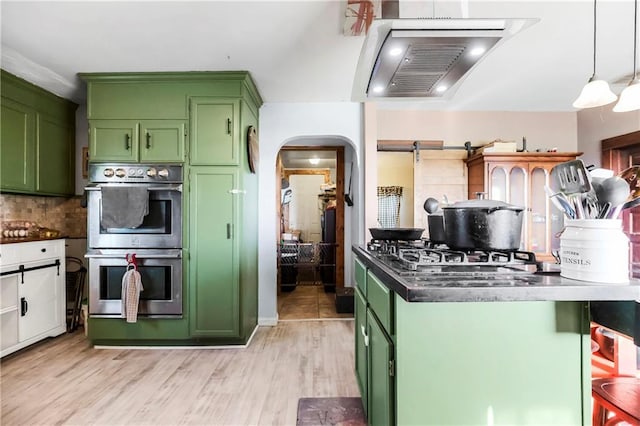 1332 Clark Rd, Williamsburg, KS 66095 - kitchen with green cabinets, stainless steel double oven, and dark countertops