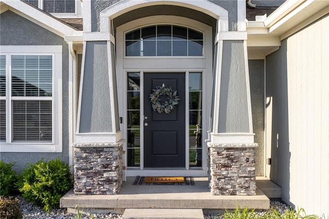 1238 NW 94th Ter, Kansas City, MO 64155 - doorway to property with stone siding and stucco siding