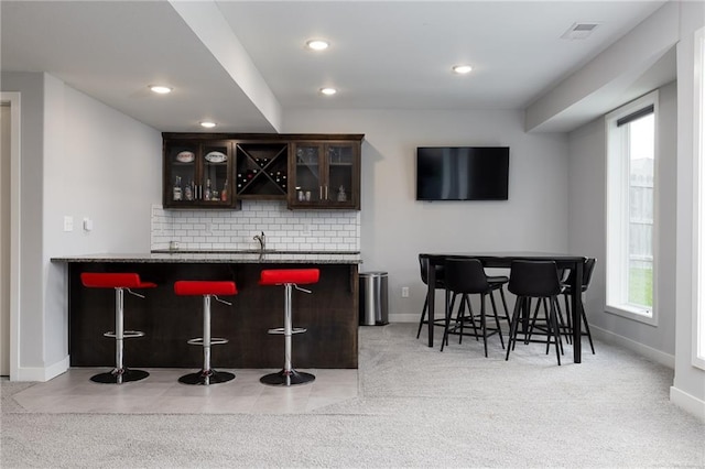 1238 NW 94th Ter, Kansas City, MO 64155 - indoor wet bar featuring backsplash, light carpet, recessed lighting, and baseboards
