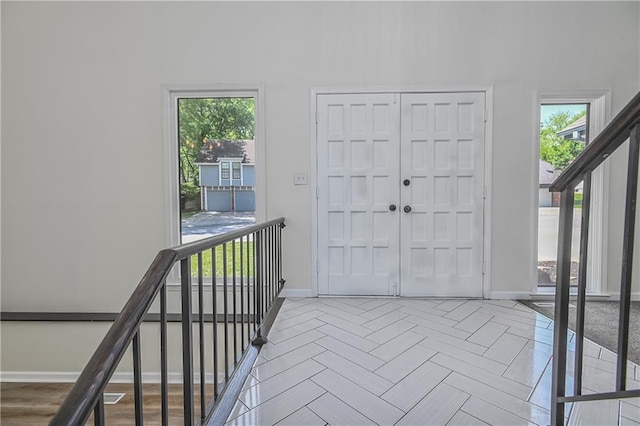 3512 Apple Tree Ln, Gladstone, MO 64119 - entrance foyer with baseboards and healthy amount of natural light
