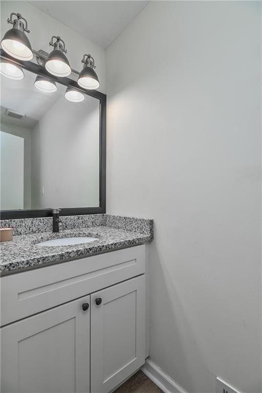 3512 Apple Tree Ln, Gladstone, MO 64119 - bathroom featuring vanity and baseboards