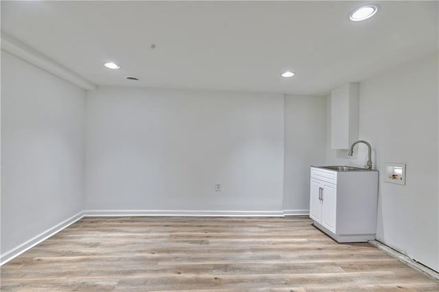 3512 Apple Tree Ln, Gladstone, MO 64119 - clothes washing area featuring recessed lighting, washer hookup, light wood finished floors, and baseboards