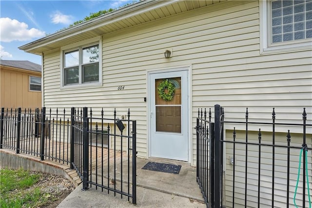 entrance to property featuring fence and a gate