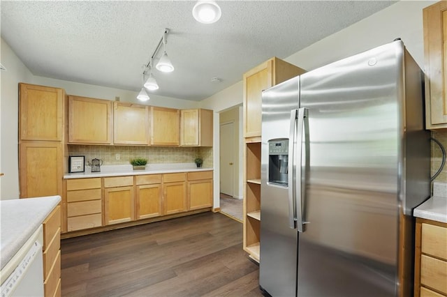 kitchen with stainless steel fridge, dishwasher, light countertops, dark wood-style flooring, and a textured ceiling