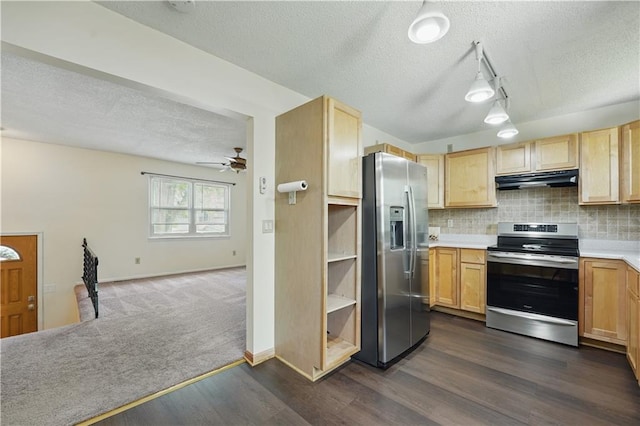 kitchen with appliances with stainless steel finishes, a textured ceiling, under cabinet range hood, light brown cabinets, and ceiling fan