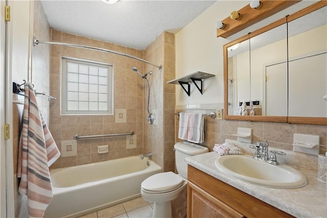 full bath with toilet,  shower combination, tile patterned floors, vanity, and a textured ceiling