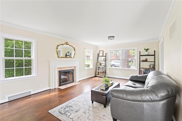 6843 Locust St, Kansas City, MO 64131 - living room featuring ornamental molding, wood finished floors, a fireplace, and baseboards