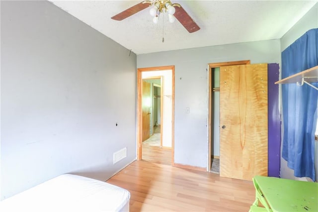 1175 SW State Route 58th Hwy, Holden, MO 64040 - bedroom featuring light wood-type flooring and ceiling fan