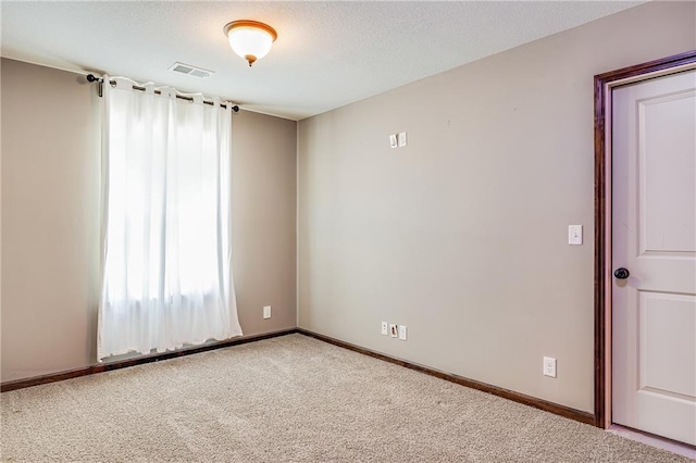 4000 S Buckner Tarsney Rd, Grain Valley, MO 64029 - empty room with carpet floors, baseboards, and a textured ceiling