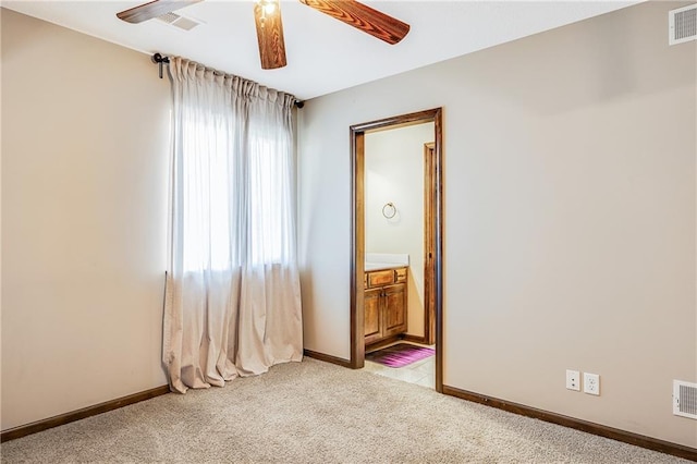 4000 S Buckner Tarsney Rd, Grain Valley, MO 64029 - empty room featuring ceiling fan, light colored carpet, and baseboards