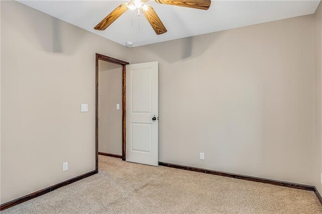 4000 S Buckner Tarsney Rd, Grain Valley, MO 64029 - unfurnished room with light colored carpet, ceiling fan, baseboards, and a smoke detector