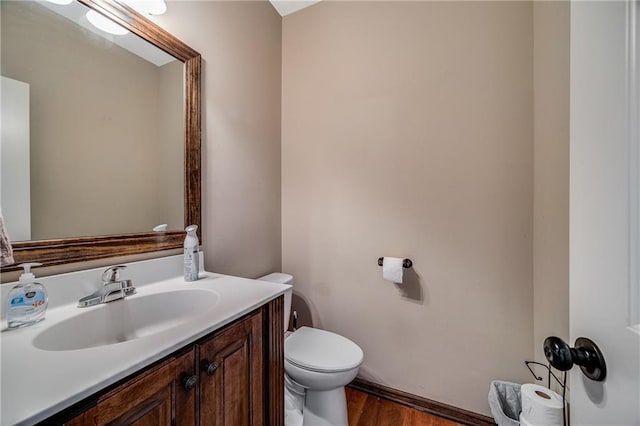 4000 S Buckner Tarsney Rd, Grain Valley, MO 64029 - bathroom with vanity, toilet, and wood finished floors