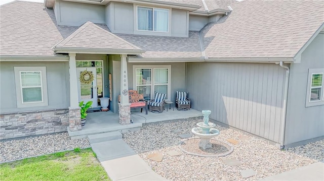 4000 S Buckner Tarsney Rd, Grain Valley, MO 64029 - property entrance with covered porch and a shingled roof