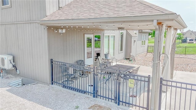 4000 S Buckner Tarsney Rd, Grain Valley, MO 64029 - property entrance featuring roof with shingles and a cooling unit