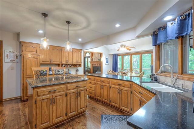 1407 SW Meyer Blvd, Blue Springs, MO 64015 - kitchen featuring a sink, dark wood finished floors, recessed lighting, ceiling fan, and a peninsula