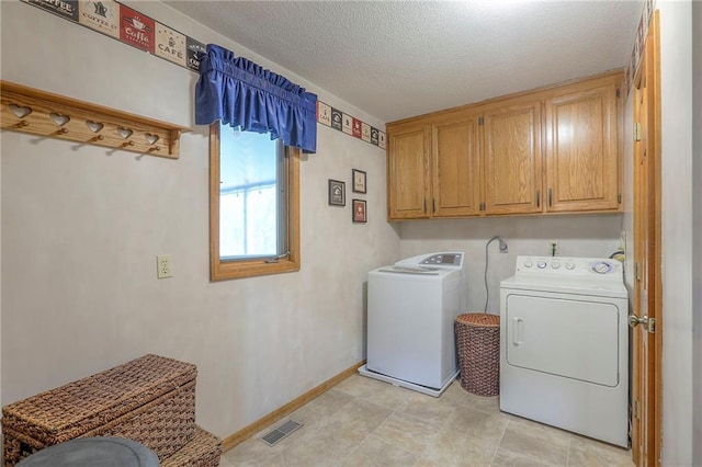 1407 SW Meyer Blvd, Blue Springs, MO 64015 - clothes washing area with cabinet space, washer and dryer, baseboards, and a textured ceiling