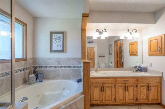 1407 SW Meyer Blvd, Blue Springs, MO 64015 - bathroom with toilet, a whirlpool tub, and double vanity