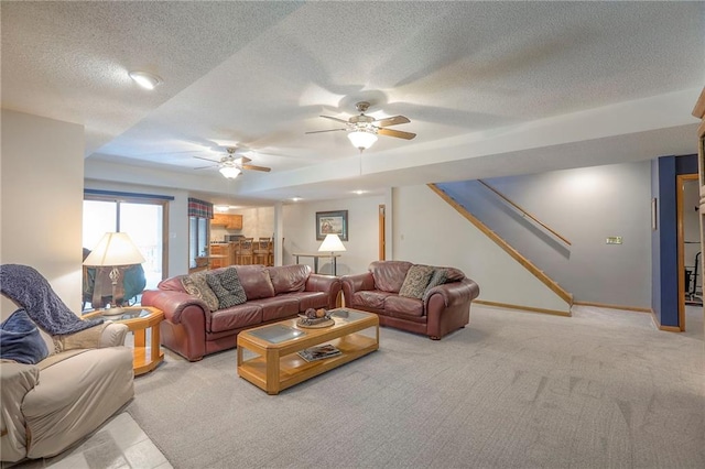 1407 SW Meyer Blvd, Blue Springs, MO 64015 - living room with a textured ceiling, stairway, carpet flooring, baseboards, and a tray ceiling