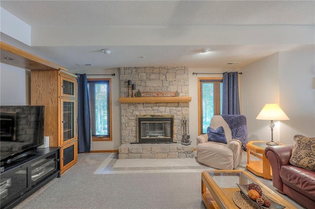 1407 SW Meyer Blvd, Blue Springs, MO 64015 - living area featuring a stone fireplace, carpet, a textured ceiling, and baseboards