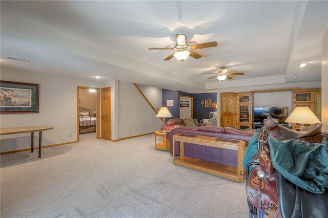 1407 SW Meyer Blvd, Blue Springs, MO 64015 - living area featuring baseboards, ceiling fan, stairs, a raised ceiling, and carpet floors