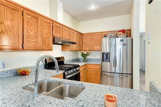 1201 N Mart-Way Dr Unit 109, Olathe, KS 66061 - kitchen featuring appliances with stainless steel finishes, under cabinet range hood, a sink, light stone countertops, and recessed lighting