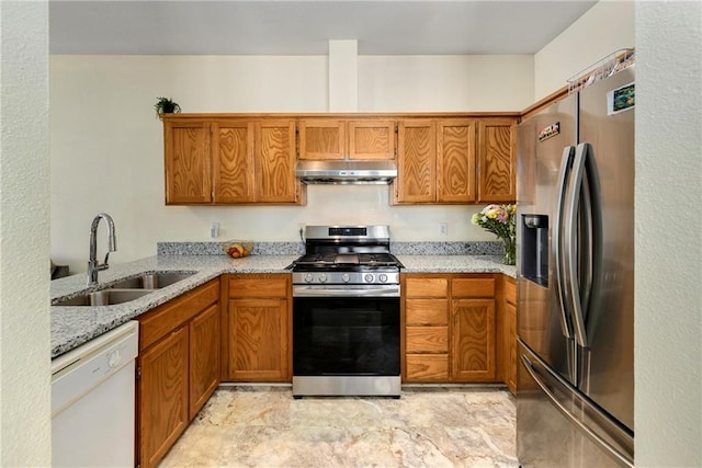 1201 N Mart-Way Dr Unit 109, Olathe, KS 66061 - kitchen featuring stainless steel appliances, a sink, under cabinet range hood, brown cabinetry, and light stone countertops