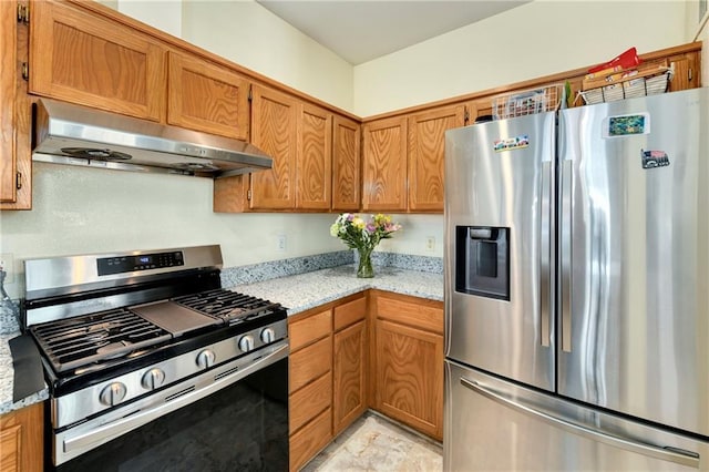 1201 N Mart-Way Dr Unit 109, Olathe, KS 66061 - kitchen with appliances with stainless steel finishes, under cabinet range hood, brown cabinets, and light stone counters