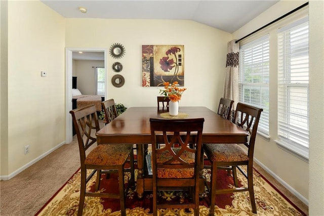 1201 N Mart-Way Dr Unit 109, Olathe, KS 66061 - dining room with vaulted ceiling, plenty of natural light, baseboards, and carpet floors