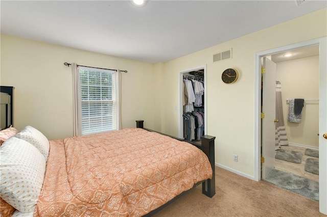 1201 N Mart-Way Dr Unit 109, Olathe, KS 66061 - carpeted bedroom with a spacious closet, a closet, baseboards, and ensuite bath