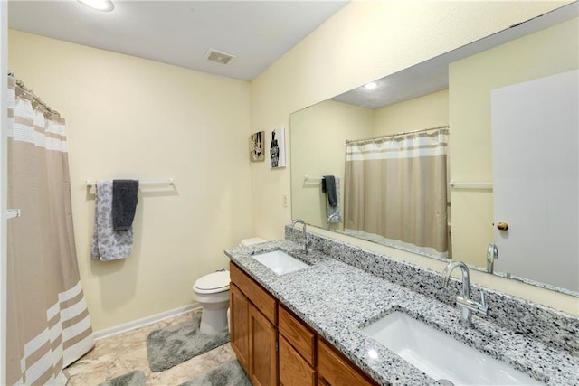1201 N Mart-Way Dr Unit 109, Olathe, KS 66061 - full bathroom with toilet, double vanity, baseboards, and a shower with curtain