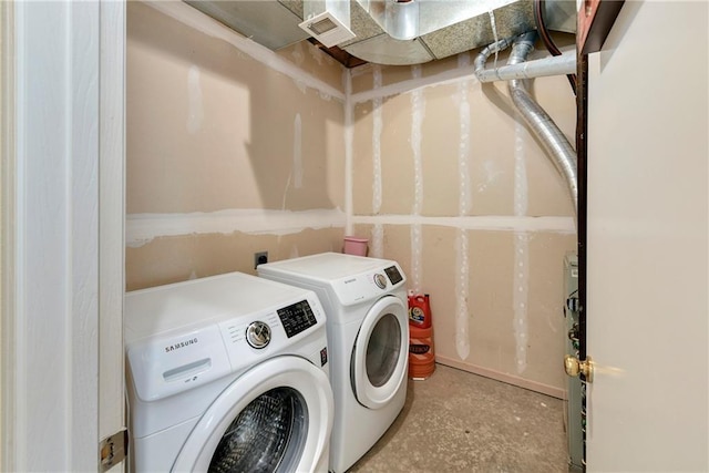 1201 N Mart-Way Dr Unit 109, Olathe, KS 66061 - laundry area with washing machine and clothes dryer