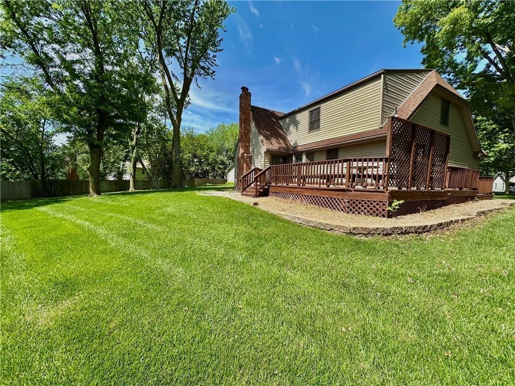 10951 Nieman Rd, Overland Park, KS 66210 - rear view of property with a deck and a chimney