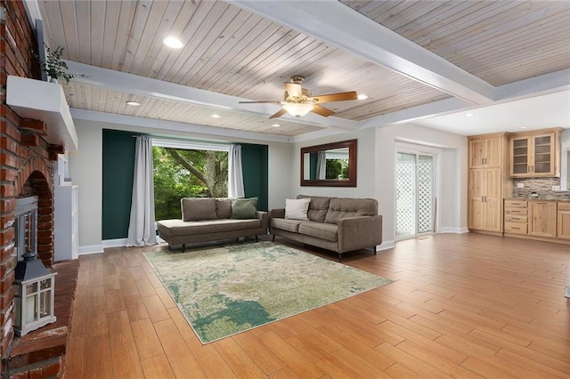 10234 Monrovia St, Lenexa, KS 66215 - living area featuring baseboards, ceiling fan, light wood-style flooring, a fireplace, and recessed lighting