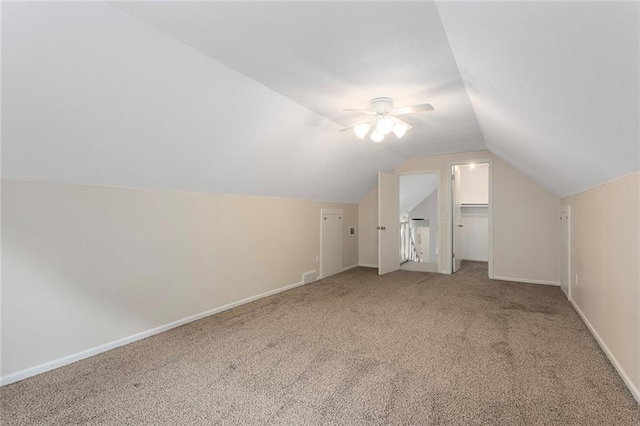 10234 Monrovia St, Lenexa, KS 66215 - bonus room with carpet flooring, lofted ceiling, baseboards, and a ceiling fan
