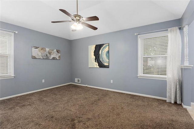 10234 Monrovia St, Lenexa, KS 66215 - carpeted empty room with a ceiling fan, lofted ceiling, plenty of natural light, and baseboards