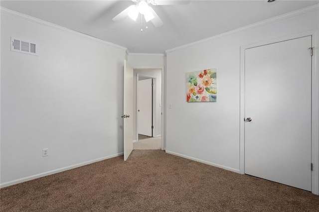 10234 Monrovia St, Lenexa, KS 66215 - unfurnished bedroom featuring carpet floors, ornamental molding, baseboards, and ceiling fan