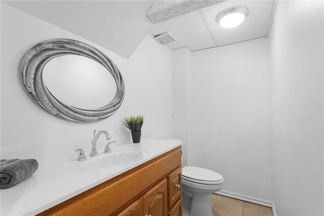 10234 Monrovia St, Lenexa, KS 66215 - bathroom with vanity, toilet, and tile patterned floors