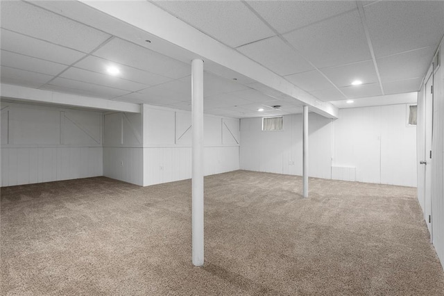 10234 Monrovia St, Lenexa, KS 66215 - finished basement with carpet floors, a paneled ceiling, recessed lighting, and a decorative wall
