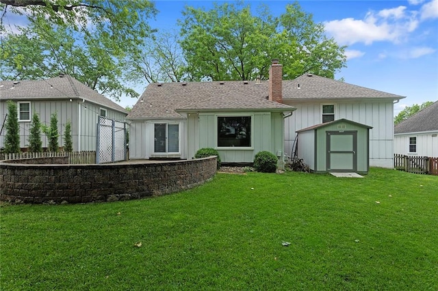 10234 Monrovia St, Lenexa, KS 66215 - back of property featuring a chimney, board and batten siding, and a shingled roof
